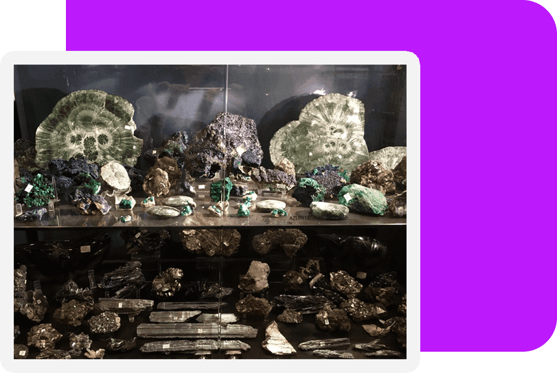 A display of rocks and minerals in a room.