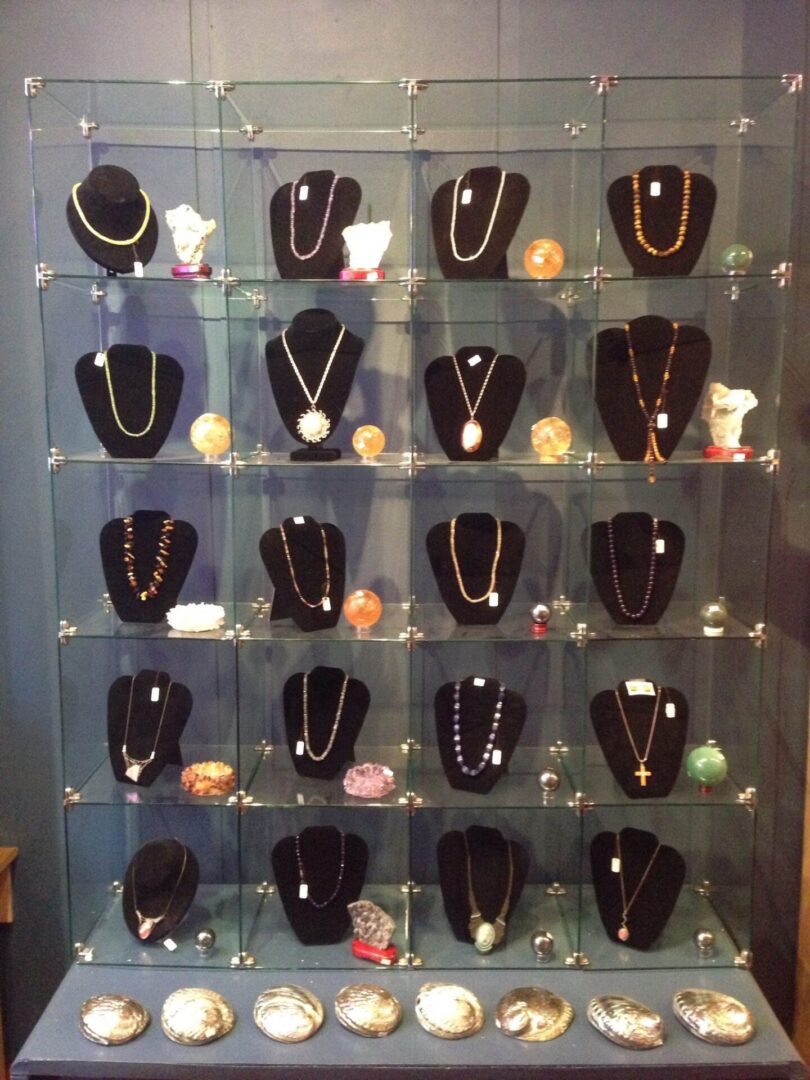 A wall of jewelry is shown on display.